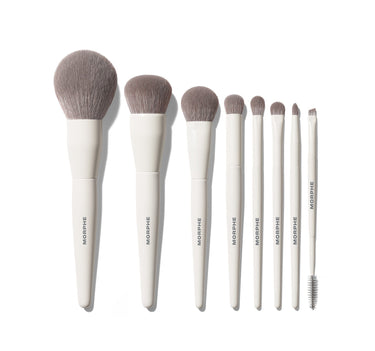 Morphe Best Of Blends 8 Piece Face Eye Brush Set with cream handles labeled "MORPHE," gray bristles in descending sizes, including a spoolie. | Best of Blends 8-Piece Face & Eye Brush Set