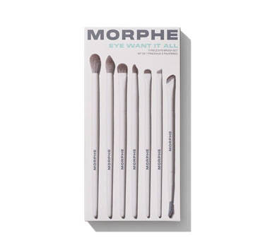 Morphe Eye Want It All 7-Piece Eye Brush Set packaging with seven taupe-bristled brushes labeled MORPHE, reading "EYE WANT IT ALL / 7-PIECE EYE BRUSH SET / KIT DE 7 PINCEAUX À PAUPIÈRES."
