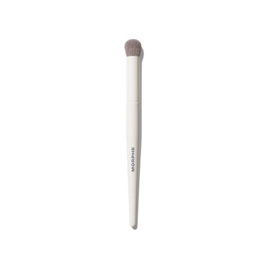Morphe M133 Domed Concealer Brush with cream white handle printed with MORPHE and soft gray domed bristles on white background. | M133 Domed Concealer Brush