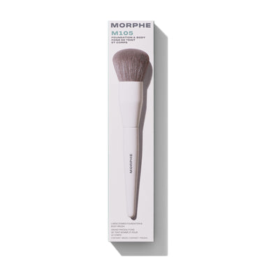 Morphe M105 Large Domed Foundation & Body Brush in white packaging labeled "MORPHE M105 FOUNDATION & BODY FOND DE TEINT ET CORPS" with taupe domed bristles and "MORPHE" on the handle.