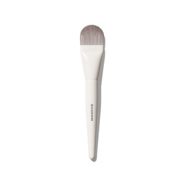 Morphe M107 Paddle Cream & Liquid Foundation Brush with white tapered handle labeled MORPHE and flat paddle-shaped gray bristles. | M107 Paddle Cream & Liquid Foundation Brush