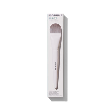 Morphe M107 Paddle Cream & Liquid Foundation Brush in white box labeled "MORPHE M107 FOUNDATION FOND DE TEINT PADDLE CREAM & LIQUID FOUNDATION BRUSH PINCEAU FOND DE TEINT CRÈME ET LIQUIDE PLAT CONTAINS 1 BRUSH / CONTIENT 1 PINCEAU."