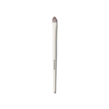 Morphe M134 Pointed Paddle Concealer Brush with cream handle and dense pointed taupe synthetic bristles, MORPHE engraved on shaft. | M134 Pointed Paddle Concealer Brush