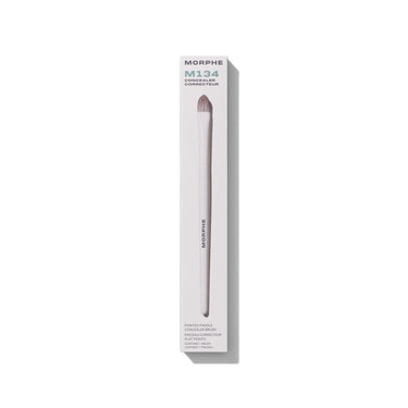 M134 Pointed Paddle Concealer Brush in white retail box. Embedded text: "MORPHE M134 CONCEALER CORRECTEUR POINTED PADDLE CONCEALER BRUSH PINCEAU CORRECTEUR PLAT POINTU CONTAINS 1 BRUSH / CONTIENT 1 PINCEAU" | M134 Pointed Paddle Concealer Brush | Secondary image