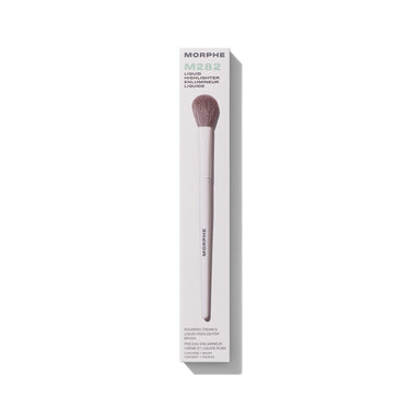 Morphe M282 Rounded Cream & Liquid Highlighter Brush in packaging labeled "MORPHE M282 LIQUID HIGHLIGHTER ENLUMINEUR LIQUIDE ROUNDED CREAM & LIQUID HIGHLIGHTER BRUSH CONTAINS 1 BRUSH" with taupe dome bristles and white handle. | M282 Rounded Cream & Liquid Highlight Brush | Secondary image