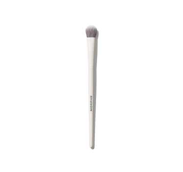 M131 Rounded Paddle Concealer Brush with cream MORPHE handle and tapered rounded bristles for light, buildable concealing. | M131 Rounded Paddle Concealer Brush
