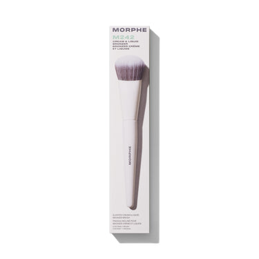 Morphe M242 Slanted Cream & Liquid Bronzer Brush in white packaging labeled "MORPHE M242 CREAM & LIQUID BRONZER / BRONZER CRÈME ET LIQUIDE / SLANTED CREAM & LIQUID BRONZER BRUSH / PINCEAU INCLINÉ POUR BRONZER CRÈME ET LIQUIDE / CONTAINS 1 BRUSH / CONTIENT 1 PINCEAU." | M242 Slanted Cream & Liquid Bronzer Brush | Secondary image