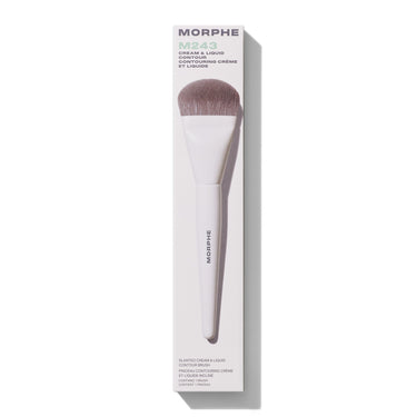 Morphe M243 Slanted Cream & Liquid Contour Brush with white handle and taupe bristles shown next to box reading "MORPHE M243 CREAM & LIQUID CONTOUR SLANTED CREAM & LIQUID CONTOUR BRUSH CONTAINS 1 BRUSH."