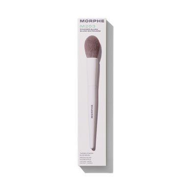Morphe M203 Tapered Powder Blush Brush in white retail box labeled "MORPHE M203 POWDER BLUSH BLUSH EN POUDRE TAPERED POWDER BLUSH BRUSH PINCEAU BLUSH POUDRE EFFILÉ CONTAINS 1 BRUSH CONTIENT 1 PINCEAU" with mauve bristles and white MORPHE-stamped handle. | M203 Tapered Powder Blush Brush | Secondary image
