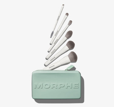 Along For The Glide 6 Piece Travel Brush Set — six white-handled Morphe brushes with gray bristles fanning out of a mint-green zippered case embossed with MORPHE.