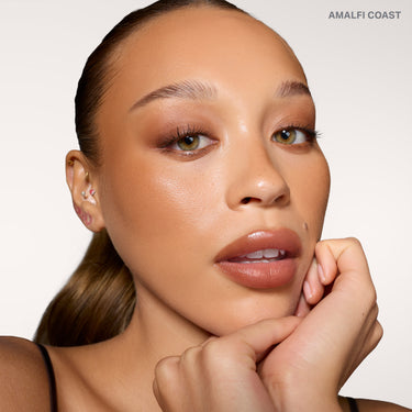 {Amalfi Coast} Model wearing Cheek Thrills Bronze Tone Duos in shade AMALFI COAST, showcasing a sun-kissed bronzed complexion.