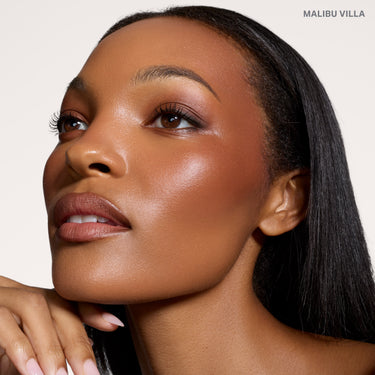 {Malibu Villa} Model wearing Cheek Thrills Bronze Tone Duos in shade MALIBU VILLA, showcasing a warm bronzed glow on deep skin.