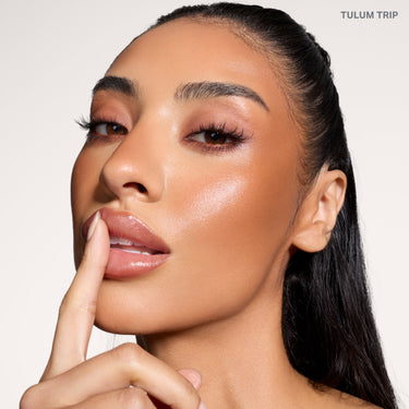 {Tulum Trip} Model wearing Cheek Thrills Bronze Tone Duos in shade TULUM TRIP, showing warm bronzed glow and luminous skin finish.