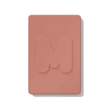 {After Party} Closed compact of the Morphe Cheek Thrills Multi-Finish Face Trio in warm terracotta with an embossed M logo on the lid.
