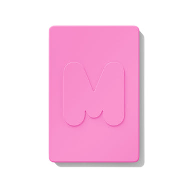 {Apres-Ski} Closed bright pink Cheek Thrills Multi Finish Face Trio compact with embossed Morphe M logo on lid, on white background.