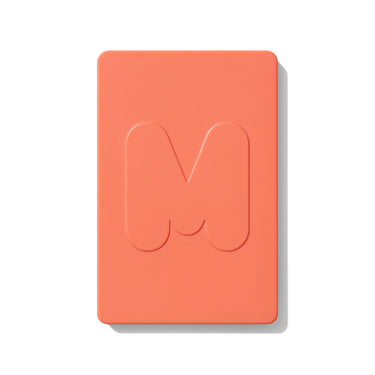 {Poolside Spritz} Closed coral Morphe Cheek Thrills Multi-Finish Face Trio compact with embossed M logo on white background.