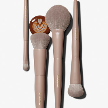 Morphe Iced Mocha Custom Blends 4-Piece Face Brush Set in warm taupe with latte art prop, featuring M110, M136, M163, and M205 brushes