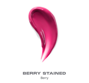 {Berry Stained} Dripglass Glazed High Shine Lip Gloss swatch in Berry Stained shade showing a deep berry-pink glossy smear with wet high-shine finish; text reads "BERRY STAINED Berry"