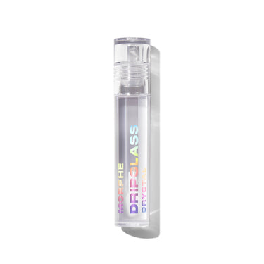 Morphe Dripglass Crystal Super Shine Lip Gloss clear tube with iridescent logo, closed cap, standing upright on white background.