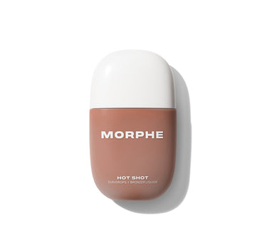 {Fire Sign} Morphe Hot Shot Sun Drops oval bottle in warm tan with white cap, labeled MORPHE HOT SHOT SUN DROPS / BRONZER LIQUIDE.