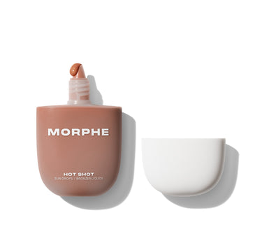 {Fire Sign} Morphe Hot Shot Sun Drops / Bronzer Liquide open rose-tan pod bottle with bronze liquid on applicator tip, white cap beside.