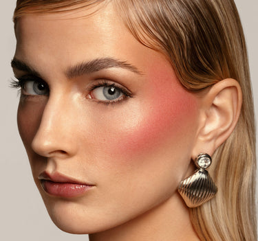 {Intoxicated (rose mauve)} Model wearing Morphe Huephoric Rush 3-In-1 Silk Blush in Intoxicated, a rose mauve blush with a luminous finish on cheeks.