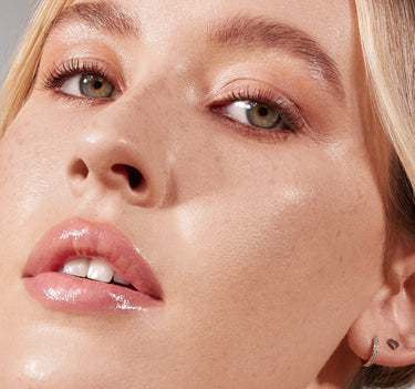 {Light 03C} Close-up model shot showing Lightform Extended Hydration Foundation in shade Light 03C with dewy, luminous finish on fair skin.