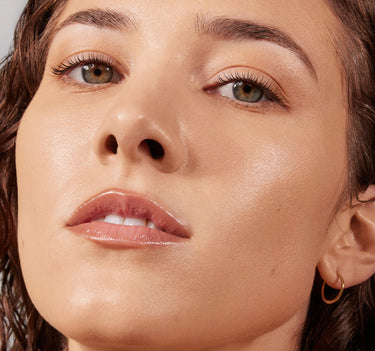 {Light 06C} Close-up of model wearing Lightform Extended Hydration Foundation in Light 06C with a dewy, radiant, glass-skin finish on medium skin.