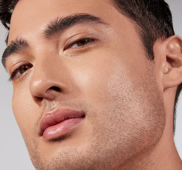{Medium 09W} Male model closeup showing Lightform Extended Hydration Foundation in shade Medium 09W with a smooth, dewy, even finish.