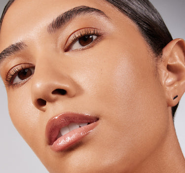 {Medium 11N} Close-up of model wearing Lightform Extended Hydration Foundation in Medium 11N with a luminous, dewy, hydrated skin finish.