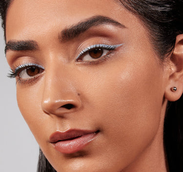 {Tan 19C} Model wearing Lightform Extended Hydration Foundation in shade Tan 19C, showcasing a luminous, dewy complexion with natural skin texture and full coverage.