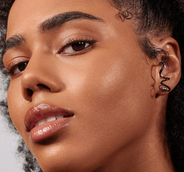 {Tan 20W} Lightform Extended Hydration Foundation worn on medium-tan skin, showing a luminous, dewy, glass-skin finish.