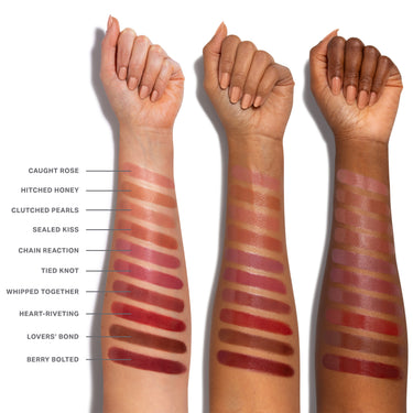 Liplock Glossy Lipstick arm swatches across three skin tones showing shades Caught Rose, Hitched Honey, Clutched Pearls, Sealed Kiss, Chain Reaction, Tied Knot, Whipped Together, Heart-Riveting, Lovers