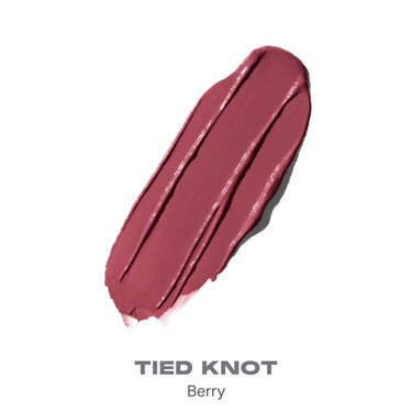 {Tied Knot} Liplock Glossy Lipstick texture smear in shade TIED KNOT Berry, a rich rosy berry tone.