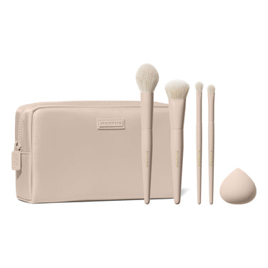 Morphe Iced Oat Latte Custom Blends 5-Piece Brush Set fanned out of beige makeup bag with eyeshadow swatch and beauty sponge | Oat Latte 5-Piece Face & Eye Brush Set