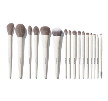 Morphe Ready Set Pro 16-Piece Face & Eye Brush Set fanned out on white, all 16 MORPHE-stamped white-handle brushes displayed from largest face to smallest eye brush. | Ready, Set, Pro 16-Piece Face & Eye Brush Set | Secondary image