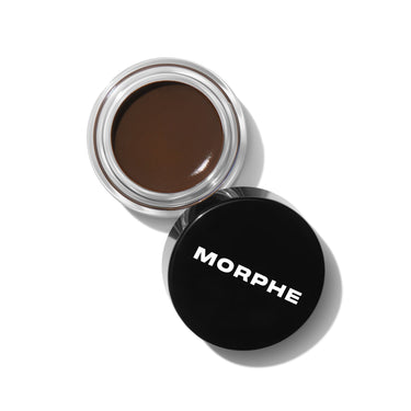 {Java (deep brown)} Open clear glass jar of Morphe Supreme Brow Sculpting And Shaping Wax in deep brown beside black lid labeled MORPHE.