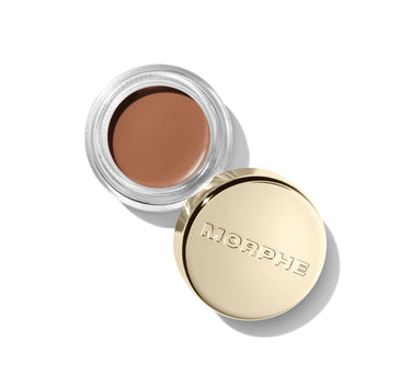 {Mixtape} Solo Artist Priming Cream Eyeshadow by Morphe in warm tan shown open in clear glass jar beside gold lid stamped MORPHE.
