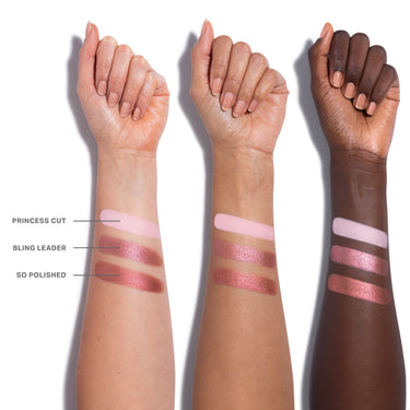 {Pinky Ring} Dazzling Metallics Eyeshadow Trio arm swatches across three skin tones showing shades Princess Cut, Bling Leader, and So Polished.