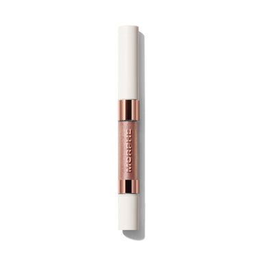 {Infamous/Anonymous} Dazzling Metallics Mixed Signals Dual-Ended Cream & Liquid Shadow Stick closed silo with MORPHE engraved on rose-gold shimmer barrel.