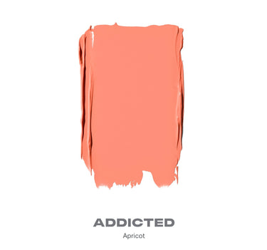 {Addicted (apricot)} Swatch of Huephoric Rush 3 In 1 Silk Blush in shade ADDICTED Apricot showing peachy-coral creamy blush texture.