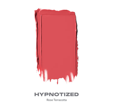 {Hypnotized (rose terracotta)} Huephoric Rush 3-In-1 Silk Blush swatch labeled HYPNOTIZED, Rose Terracotta, coral-rose color with brushstroke texture. | Huephoric Rush 3-In-1 Silk Blush | Secondary image