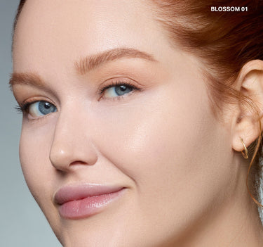 {Blossom 01} Model wearing Wakeup Artist Under Eye Correcting Concealer in BLOSSOM 01, a warm peachy-beige shade with smooth finish.
