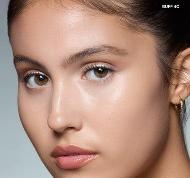 {Buff 4c} Model wearing Morphe Wakeup Artist Under Eye Correcting Concealer in BUFF 4C with brightened, dewy under-eye finish.