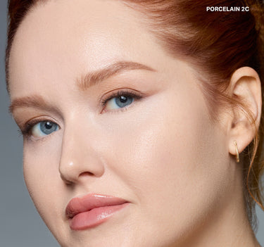 {Porcelain 2c} Model wearing Wakeup Artist Under Eye Correcting Concealer in PORCELAIN 2C with a bright, glowing under-eye finish.