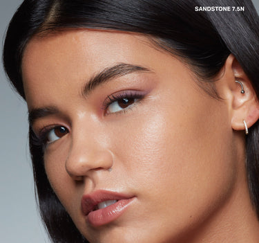 {Sandstone 7.5n} Model wearing Wakeup Artist Under Eye Correcting Concealer in SANDSTONE 7.5N, showcasing seamless under-eye coverage and luminous skin.