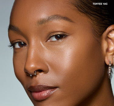 {Toffee 10c} Wakeup Artist Under Eye Correcting Concealer in TOFFEE 10C shown on model with brightened, corrected under-eye area.
