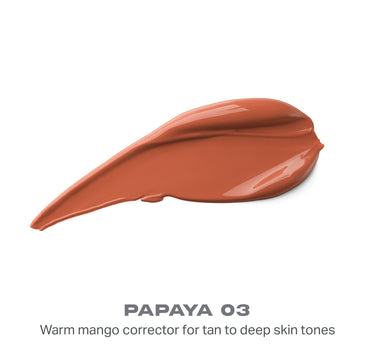 {Papaya 03} Wakeup Artist Under Eye Correcting Concealer swatch in Papaya 03 — warm terracotta smear with text "PAPAYA 03, Warm mango corrector for tan to deep skin tones."