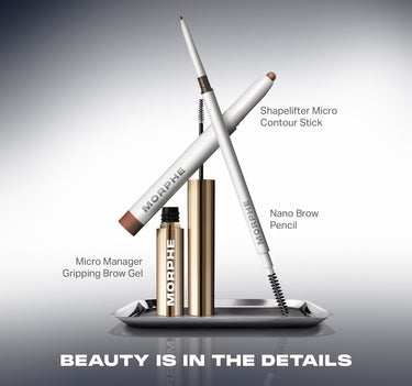 Morphe Micro Manager Gripping Brow Gel, Nano Brow Pencil, and Shapelifter Micro Contour Stick displayed on a silver tray — "BEAUTY IS IN THE DETAILS"