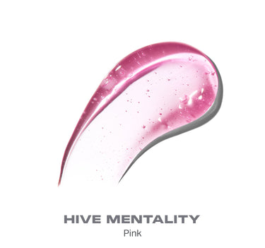 {Hive Mentality} Swatch of Hot Honeys Plumping Lip Oil in HIVE MENTALITY Pink, showing a glossy, sheer pink gel texture with subtle shimmer.